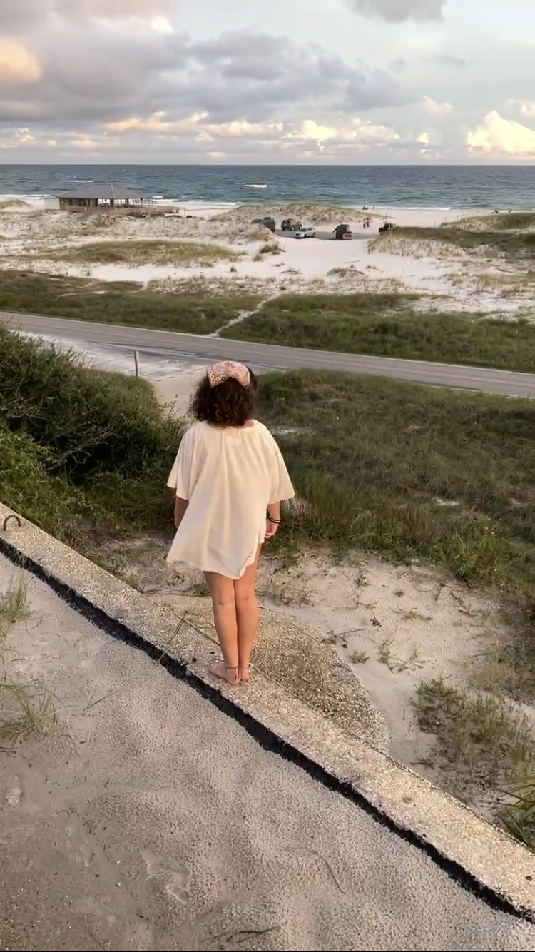 Marlie Standing on a wall at the beach