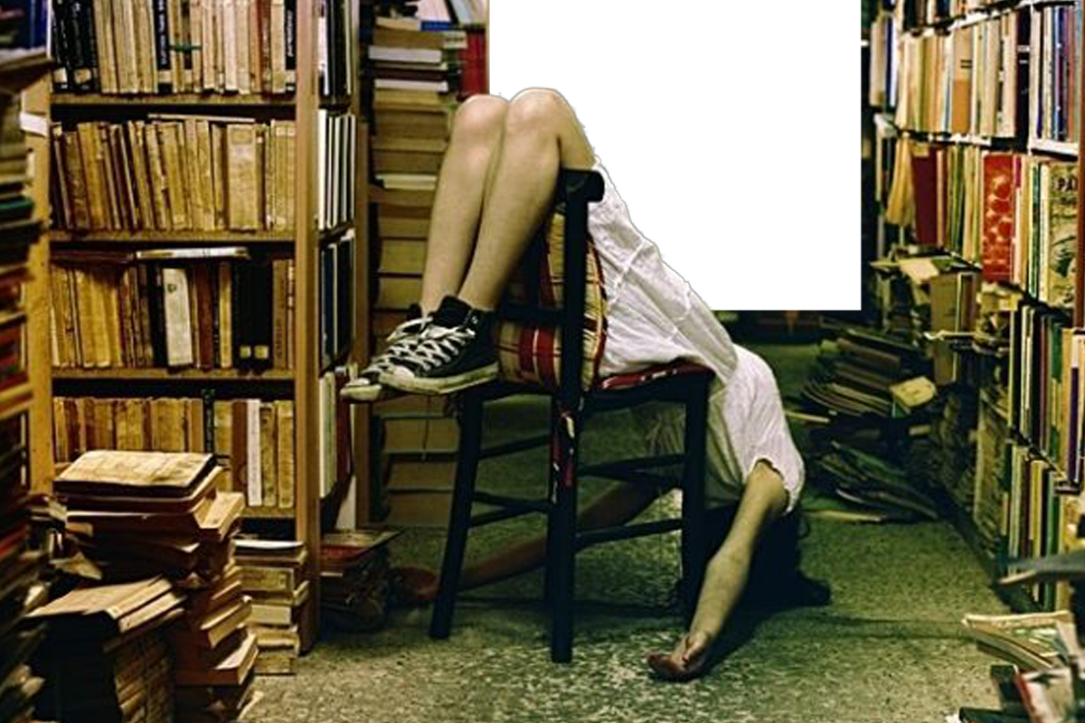 library and a girl sitting upsidedown in a chair